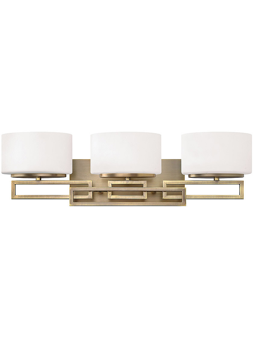 Lanza 3 Light Bath Sconce with Etched Opal Glass Shades in Brushed Bronze.